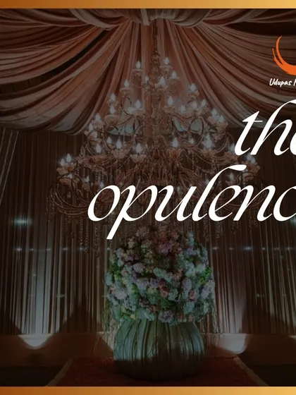 The opulence of our event decor is matched by the art of our luxury catering. This image pairs a grand chandelier with our promise of gourmet food and exceptional event services.