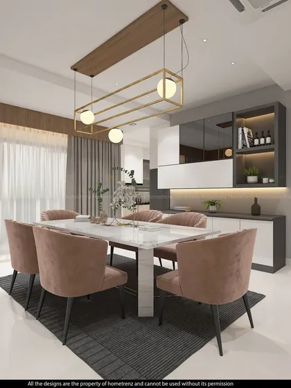 A breathtaking dining view. This setup features plush pink chairs, a white marble table, and a striking gold-finished chandelier, creating a truly luxurious dining experience.