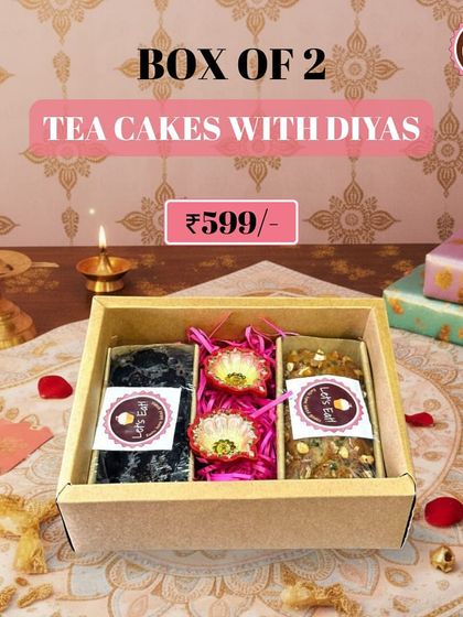 A simple yet elegant gift: a box of two delicious tea cakes paired with two handcrafted diyas. It’s a thoughtful and traditional Diwali present.