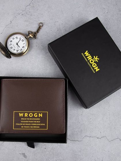 The 'WROGN' wallet with brand messaging, presented in its gift box.