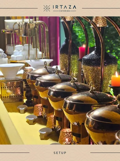 A row of my black and gold serving dishes, complemented by glittering black and gold vases. This setup is ideal for a glamorous evening affair or a chic cocktail party.