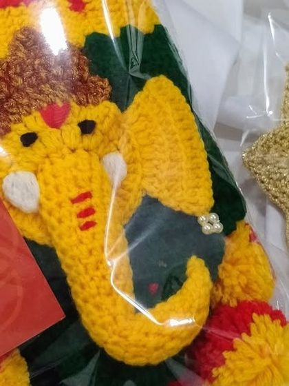 Another order ready to go. This one includes a Ganpati toran and a beautiful golden Diya holder, all carefully packed.