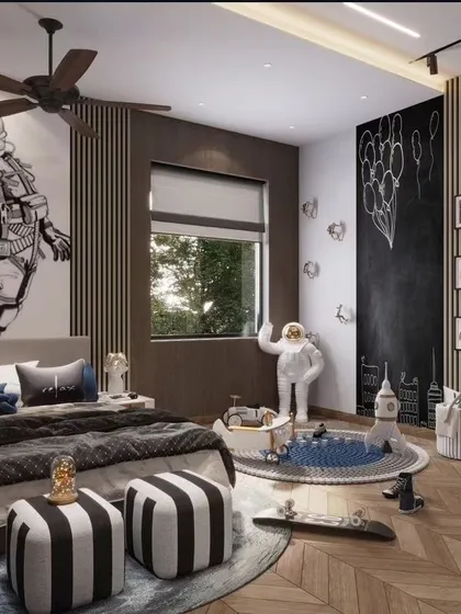We believe a child's room should be a universe of imagination. This space-themed bedroom features a bold astronaut wall mural, a chalkboard for creativity, and playful details like a rocket ship and Minion figures, creating a fun and inspiring environment that grows with the child.