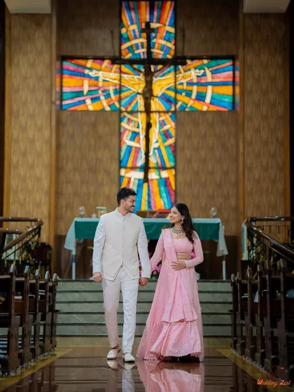 A beautiful moment from Cheryl and Edwin's Catholic engagement ceremony. I focus on capturing not just the couple, but also the stunning architecture and sacred atmosphere of the venue, like this stained-glass cross.