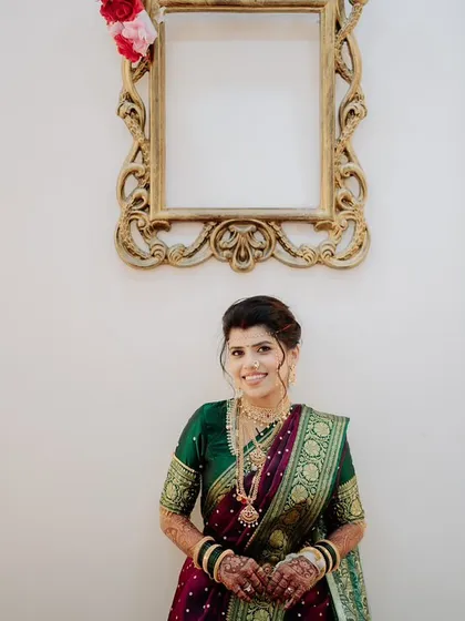 A solo portrait of the bride, looking elegant and poised against a simple backdrop.