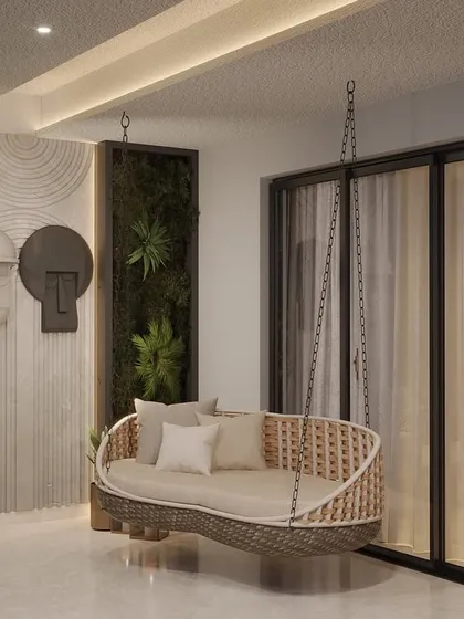 Even a compact balcony can become a stylish retreat. We installed a comfortable woven swing, vertical green panels, and unique wall art to create a cozy and visually interesting space for relaxation.