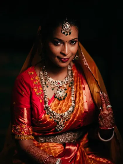 A duplicate of ID 14, this stunning portrait uses dramatic lighting to highlight a bride's grace.