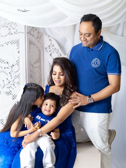 A photo filled with family affection. A sweet kiss from big sister makes this an extra special memory.