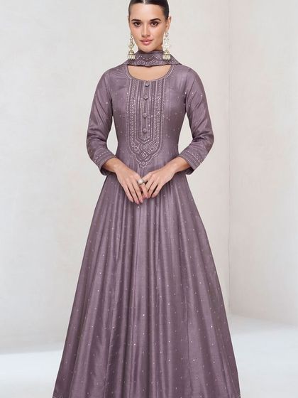 This dusty purple premium silk gown is modern and chic. The unique neckline and subtle sequin work make it a sophisticated choice for any formal event.