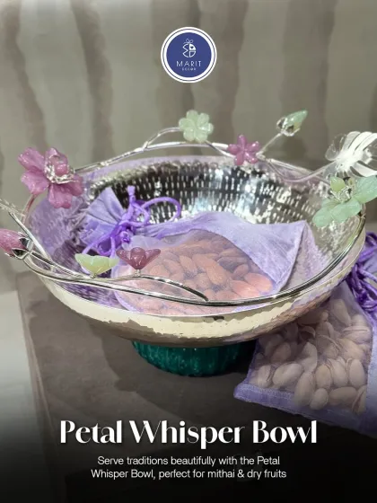 This is my Petal Whisper Bowl, an exquisite piece perfect for serving 'mithai' and dry fruits. Its hammered silver finish and delicate floral details showcase the kind of premium, reusable items I love to include in my hampers.