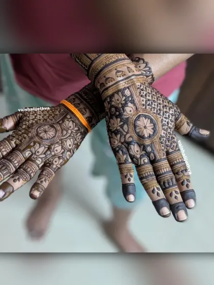 A dark and bold back-hand design. This pattern uses mandalas and floral motifs with a lot of filled-in spaces for a dramatic effect.