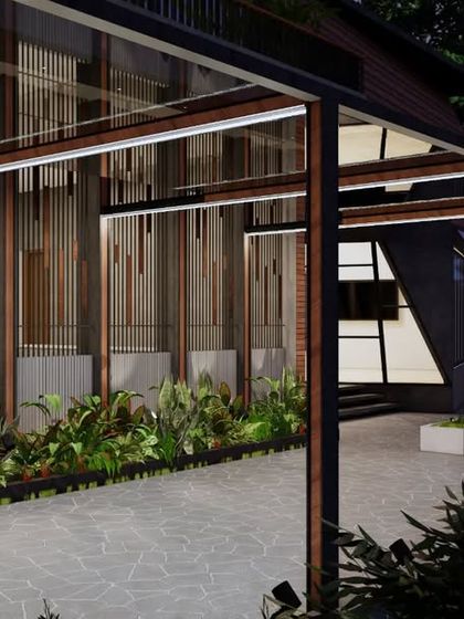 The evening view of this modern residence highlights the interplay of light and material. The metal framework and vertical louvers create a rhythmic pattern, while landscape lighting enhances the connection between the architecture and its garden.