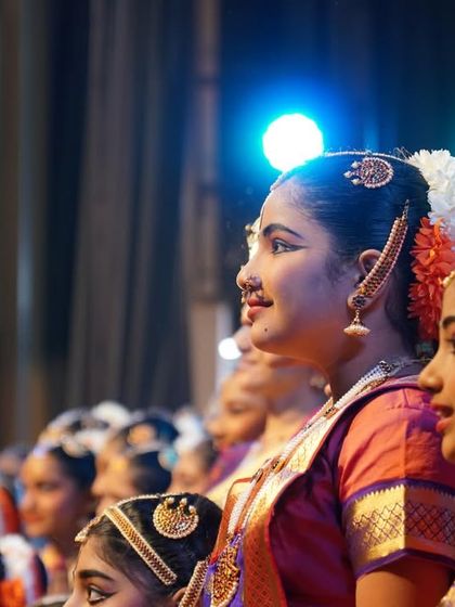 A quiet moment backstage before the performance begins. The anticipation and excitement in their eyes is a beautiful part of the Nrithya Sandhya experience.