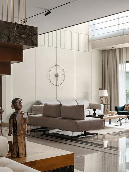 A view of the sculptural staircase at Villa Shakthi, which ascends from a marble plinth. This element is not just for circulation; it is a central feature that connects the home's levels and showcases our philosophy of integrating dramatic, functional art into our designs.