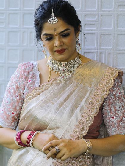 Photos from my housewarming, wearing a saree and blouse I designed myself. I took a plain tissue saree and completely transformed it with a hand-worked scalloped border and a custom-stitched velvet blouse. It’s a look that’s very close to my heart.
