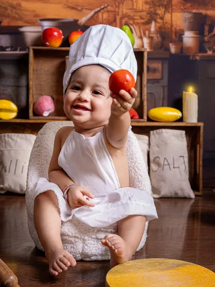 Welcome to the little chef's kitchen! This is one of my most popular creative themes, complete with a miniature kitchen backdrop, chef's hat, and fun props for your baby to interact with, resulting in adorable and playful photographs.