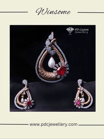 A winsome and ornate diamond pendant set in 14kt hallmarked rose gold. This piece features a central pearl and a red gemstone, surrounded by intricate diamond-studded metalwork.