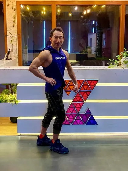 Another powerful pose highlighting the results of a dedicated fitness journey. His strength and definition are an inspiration to our entire community.