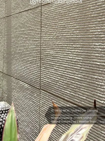 A close-up of the 'Stripe Stone' Ittimi clay cladding. This sustainable, unfired clay material is weatherproof and perfect for creating serene interior spaces.