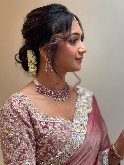 This side view shows off the beautiful, textured updo we created for Monica. A few loose strands frame her face, giving the classic hairstyle a soft and romantic feel.