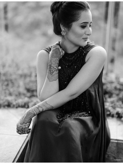 A pensive black and white portrait of Akanksha during her Mehendi. The candid, thoughtful moment provides a beautiful contrast to the usual high-energy shots.