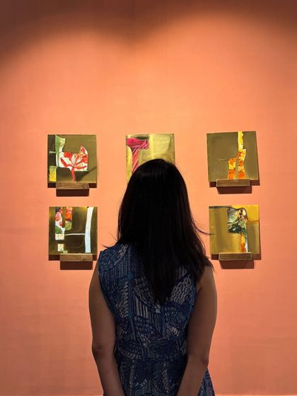 A visitor contemplating my 'Mapping Memories' series at the exhibition. I love seeing how viewers connect with the work, each finding their own story in the abstract forms.