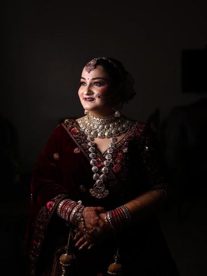 This bride chose a deep maroon velvet lehenga for her winter wedding. I created a soft glam look with a dark lip that made her look so elegant.