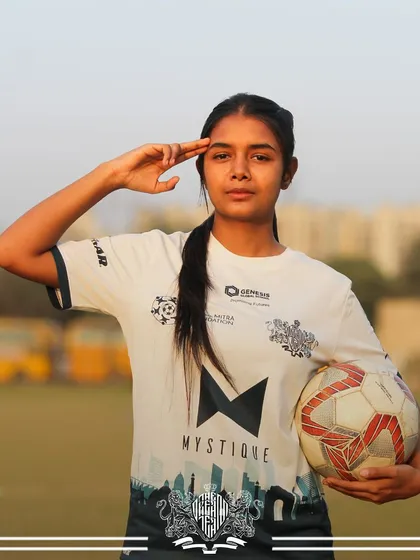 Saluting the game. A player holds a ball and gives a salute, a sign of respect and dedication.