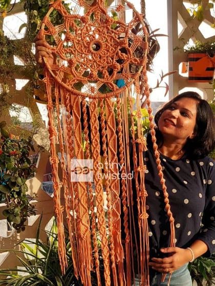 The beauty of a handmade dreamcatcher is in every single knot. This piece is 4 feet tall with a 16-inch diameter, designed to be a soothing and beautiful focal point.