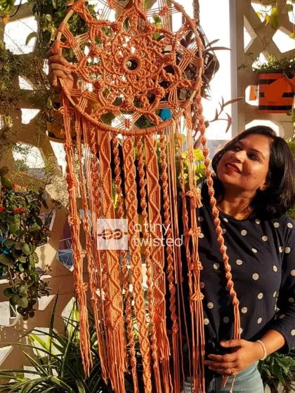 The beauty of a handmade dreamcatcher is in every single knot. This piece is 4 feet tall with a 16-inch diameter, designed to be a soothing and beautiful focal point.