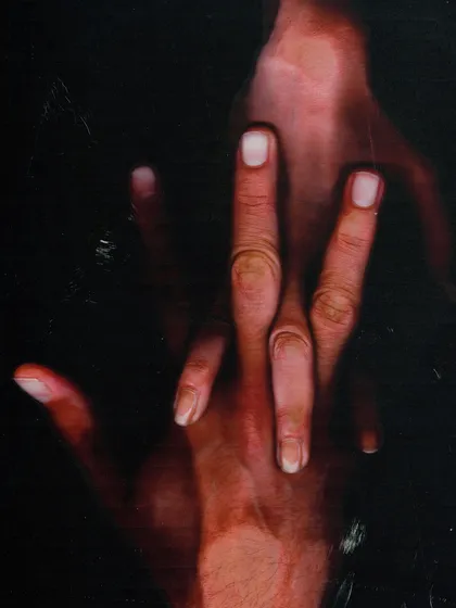 An abstract, scanned image focusing on the detail of intertwined hands. This piece is about texture, form, and connection, representing the more artistic and conceptual aspect of my work.