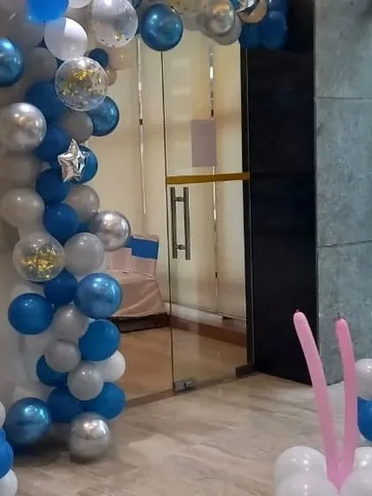 Entrance decoration with a blue and silver balloon pillar for the 2nd birthday party.