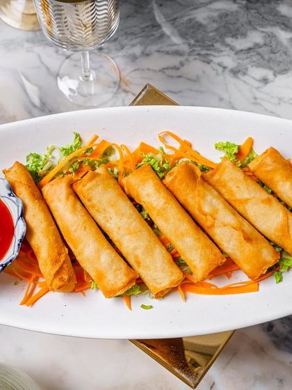 A crowd favorite, these cigar rolls are filled with a delicious mixture of gooey cheese and sweet corn.