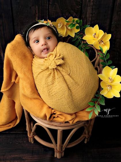 An adorable awake shot, with the baby looking curiously at the camera.