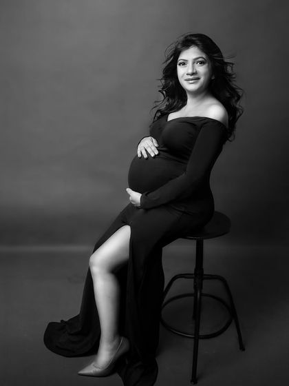A stunning seated portrait in a black gown. The monochrome treatment makes it feel even more chic and sophisticated.