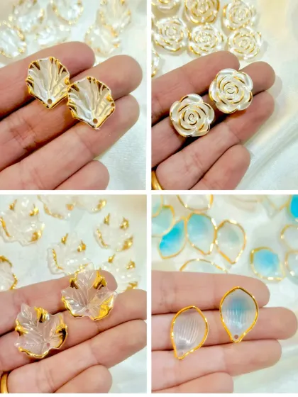 These decorative add-ons feature beautiful shell, rose, and leaf shapes with a pearlescent finish. They are perfect for creating elegant jewelry or embellishing photo frames.