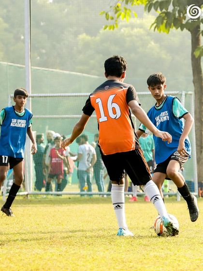 A U13 GSC Blades player challenges for the ball against a player from Fast FC.