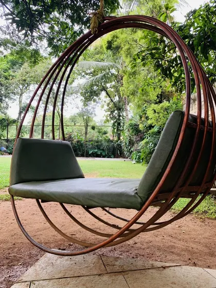 This inviting swing chair offers a perfect place to relax and soak in the tranquil atmosphere of our gardens.
