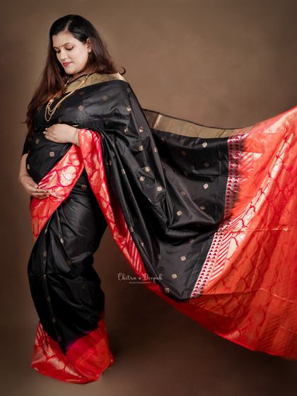 The dramatic flow of a beautiful silk saree. We love using fabric movement to add an artistic touch to our traditional portraits.