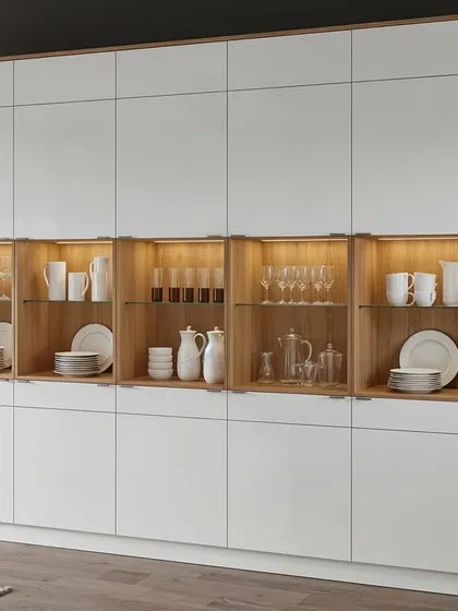 A modern, minimalist crockery unit with a mix of open, backlit shelving and clean, white handleless cabinets.