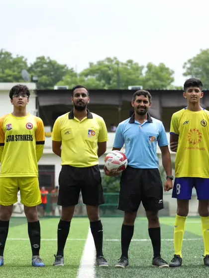 The captains of Ignite FA and Star Strikers FA with the match officials before their U15 league game. We teach sportsmanship and respect for the game.