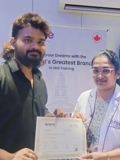 A proud moment for our student, receiving their hard-earned certificate from our head trainer. This certificate is their ticket to a successful career in the beauty industry.