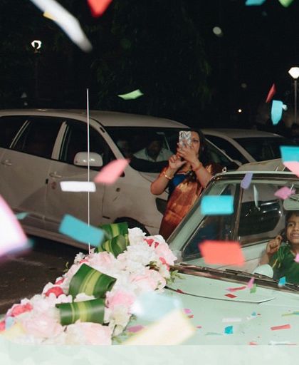 A groom's entry that combines classic style with modern fun. We arranged for a beautiful vintage car and a confetti gun for the groom to make a grand and joyful entrance.