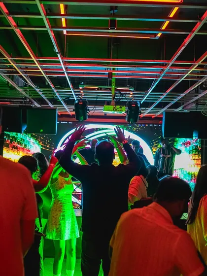 The dance floor at Gawky Goose, bathed in green and red lights. I work with the lighting to create a complete clubbing atmosphere.