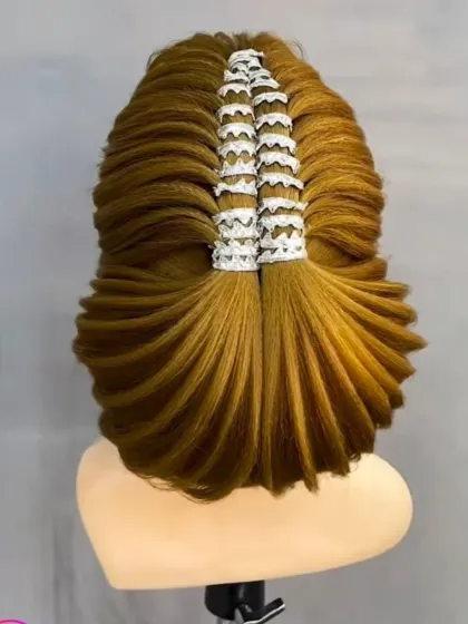 A highly technical and modern hairstyle, demonstrating advanced techniques in shaping and styling.