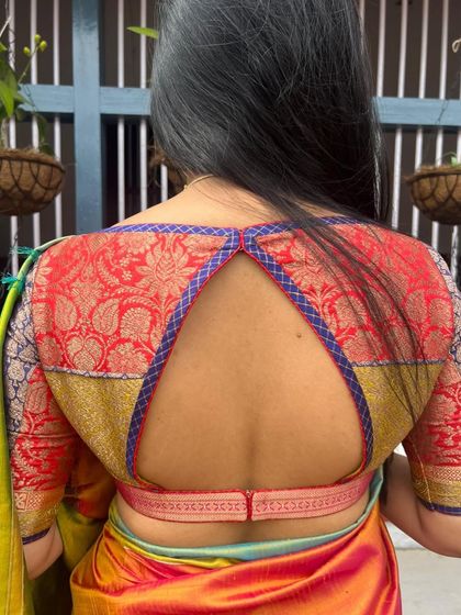 A custom patchwork blouse I designed for Neha's pre-engagement ceremony, using different brocade fabrics for a unique and colorful look.