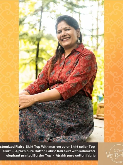 A close-up of our customer enjoying her custom-designed Ajrakh skirt and top. The happiness of a well-fitted, unique outfit is what we aim for.