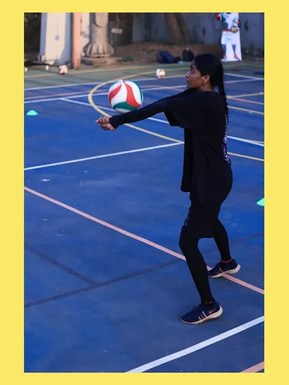 This player shows the proper technique for a bump pass, with a straight platform and controlled motion. Repetition of these basics is key to success.