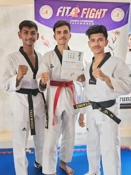 Three of our senior students proudly display their new belts and certificates after a successful promotion exam. Their progress shows the path for our junior members.