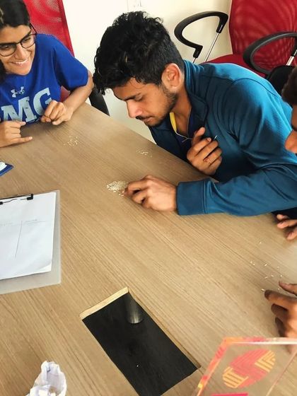 Not all training happens on the court. Here, we are doing a focus and mental strength exercise. Building a champion's mindset is just as important as building skills.